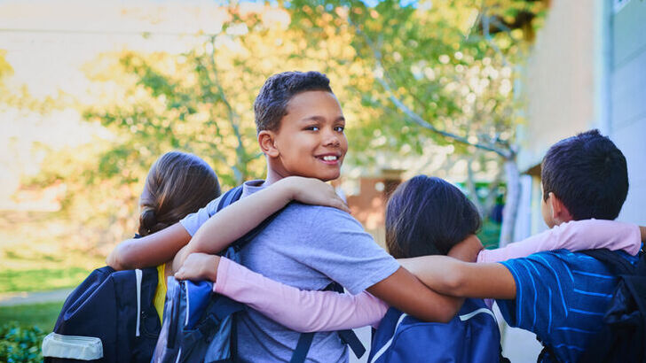 Middleschoolersembracingboylookingovershoulder2