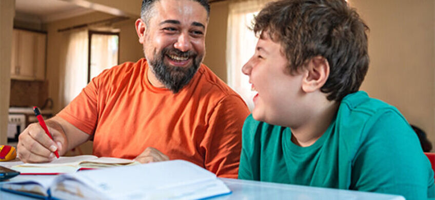father and son laughing